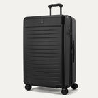 Front 3/4 view of the Travelpro Platinum Elite Large Check-In Hardside Spinner in Jet Black, featuring a high-impact polycarbonate shell, aluminum corner armor, and 360-degree spinner wheels.