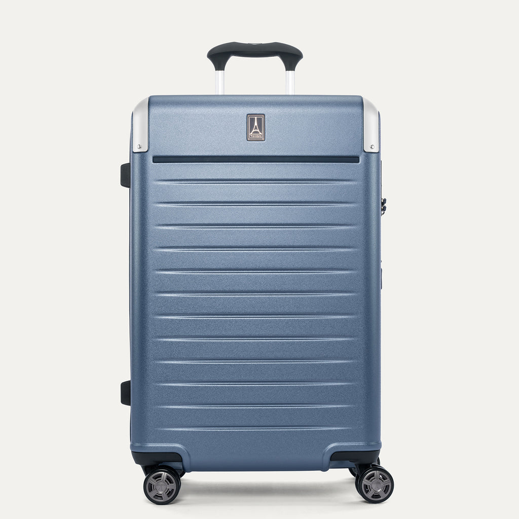 Front view of the Travelpro Platinum Elite Medium Check-In Hardside Spinner in Dark Sky Blue, featuring a durable polycarbonate shell, polished aluminum corner armor, and genuine leather trim.
