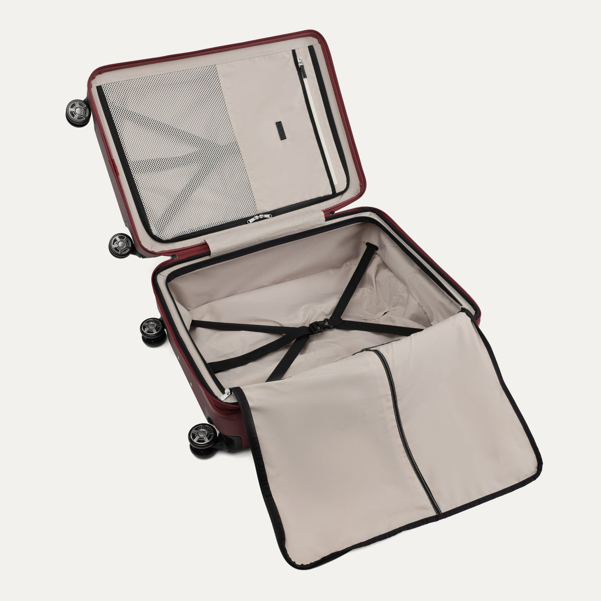 "Open interior view of the Travelpro Platinum Elite Medium Check-In Hardside Spinner in Daring Red, featuring dual zippered divider panels, adjustable compression straps, and multiple accessory pockets."