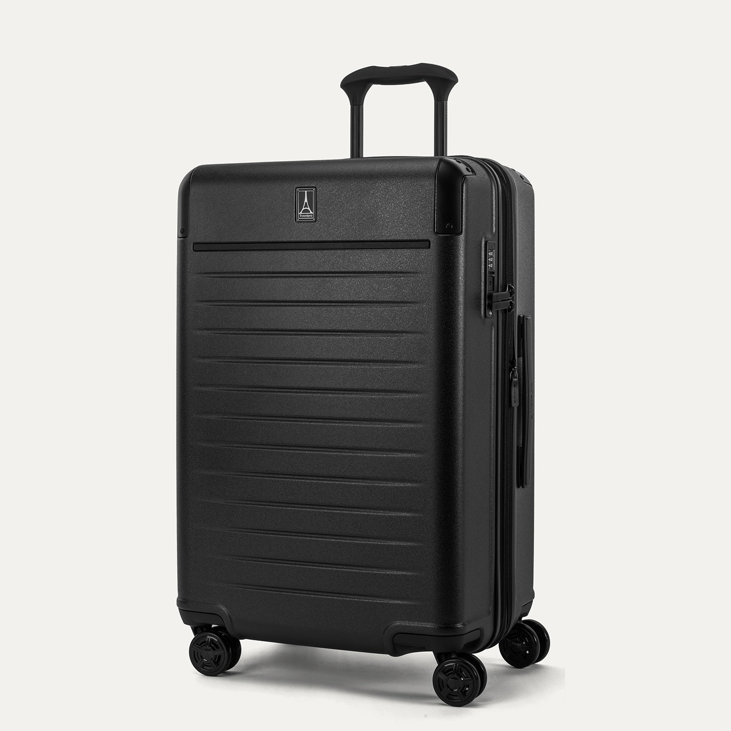Front 3/4 view of the Travelpro Platinum Elite Medium Check-In Hardside Spinner in Jet Black, featuring a durable 100% polycarbonate shell, aluminum corner armor, and 360-degree MagnaTrac spinner wheels.
