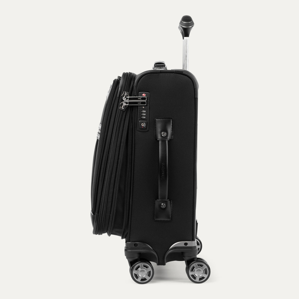 side profile view of the shadow black travelpro platinum® elite international carry-on spinner, highlighting the expansion zipper, integrated tsa-compliant lock, leather side carry handle, and dual spinner wheels.