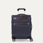 Front view of Travelpro Platinum Elite International Expandable Carry-On Spinner in True Navy, featuring genuine leather accents and the adjustable PowerScope extension handle.