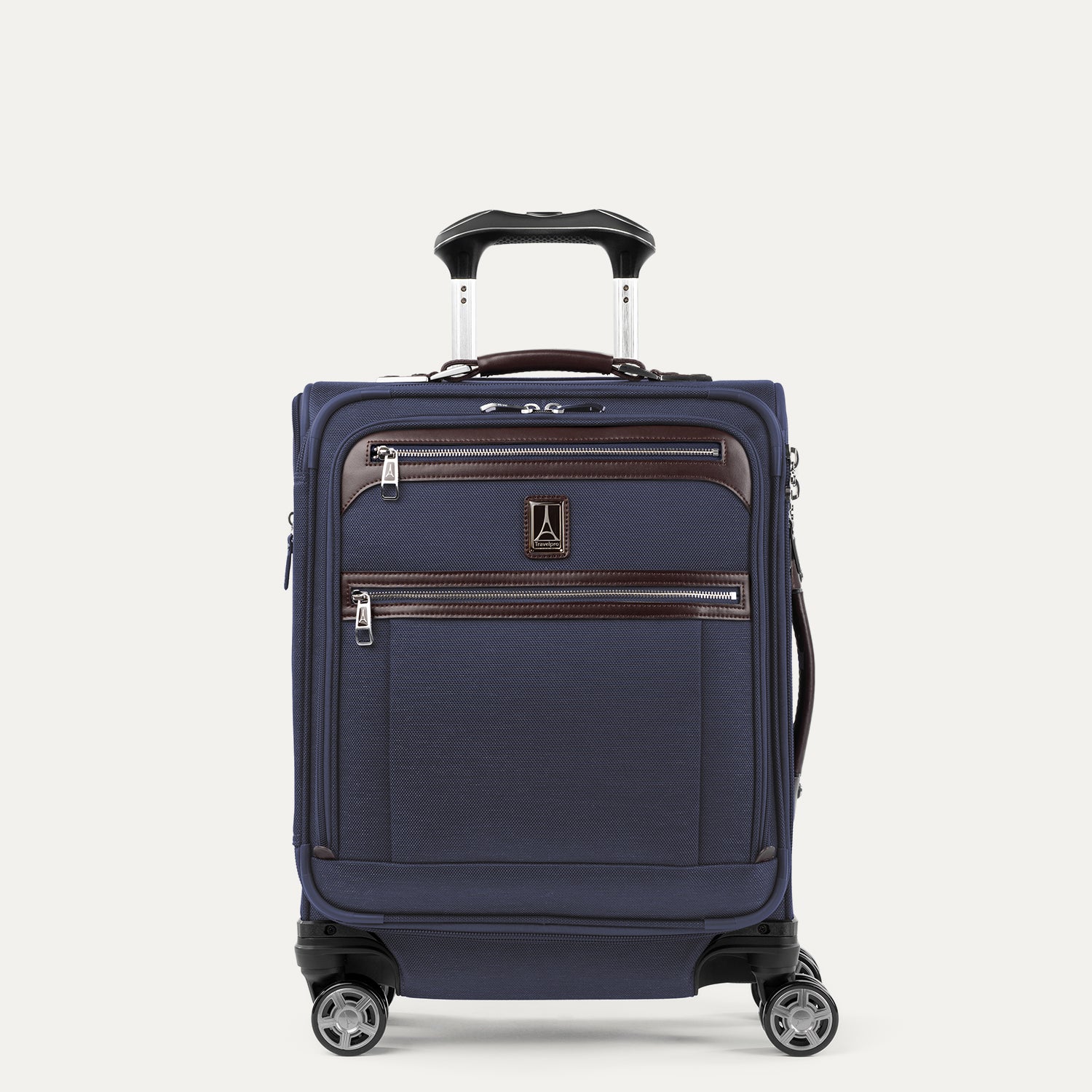 Front view of Travelpro Platinum Elite International Expandable Carry-On Spinner in True Navy, featuring genuine leather accents and the adjustable PowerScope extension handle.