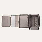 
fully opened interior view of the navy camouflage travelpro platinum elite large check-in spinner, showing the light grey ecofab lining, zippered mesh divider, built-in suiter, and adjustable tie-down straps with accessory pockets.