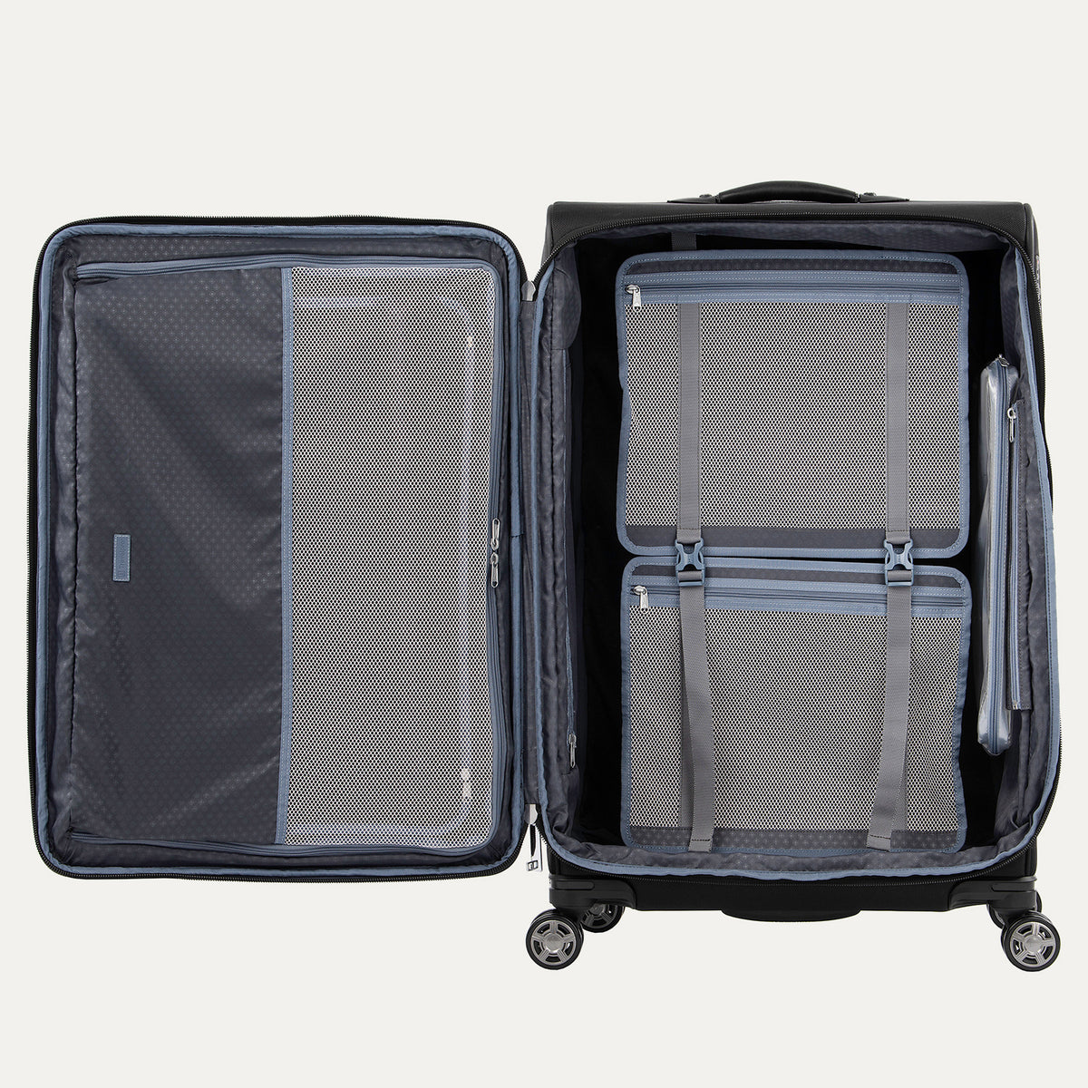 interior view of the open shadow black travelpro platinum® elite large check-in expandable spinner, showing the ecofab™ recycled lining, a large zippered mesh lid compartment, and a deluxe tie-down system with accessory pockets.
