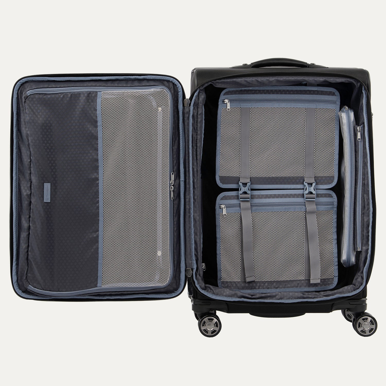 interior packing view of the open shadow black travelpro platinum elite medium check-in spinner, showing the dual-sided organization with a zippered mesh divider on one side and a deluxe tie-down system with accessory pockets on the other.