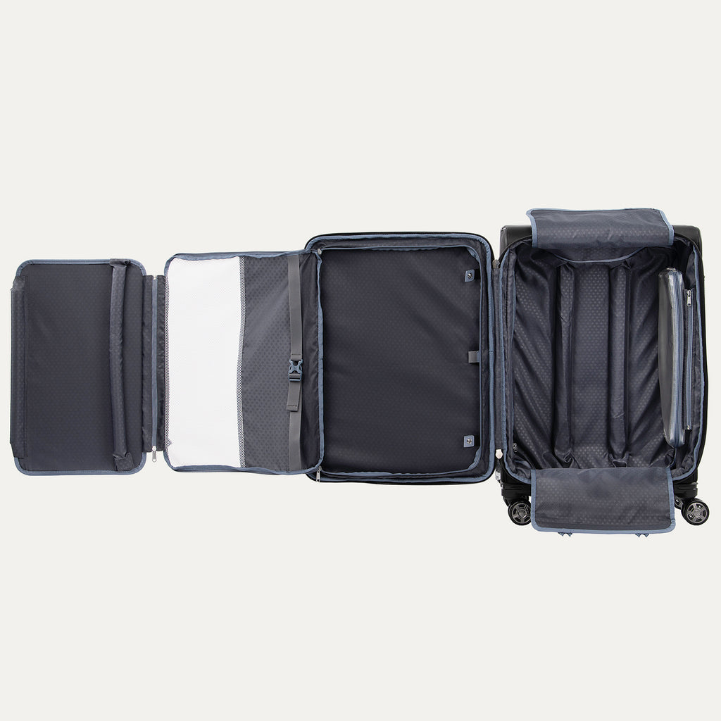fully open interior view of the shadow black travelpro platinum elite medium check-in spinner, showing the multi-functional organization system with a zippered mesh divider, built-in suiter, and adjustable hold-down straps.