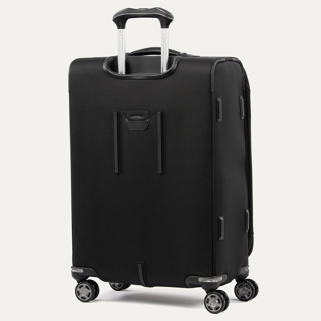 rear view of the shadow black travelpro platinum elite medium check-in softside spinner, showing the extension handle system and the durable back panel protection for frequent travel.