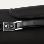 close-up view of the premium leather top carry handle on the shadow black travelpro platinum® elite rolling garment bag, showing the embossed travelpro logo and durable chrome-finished hardware.