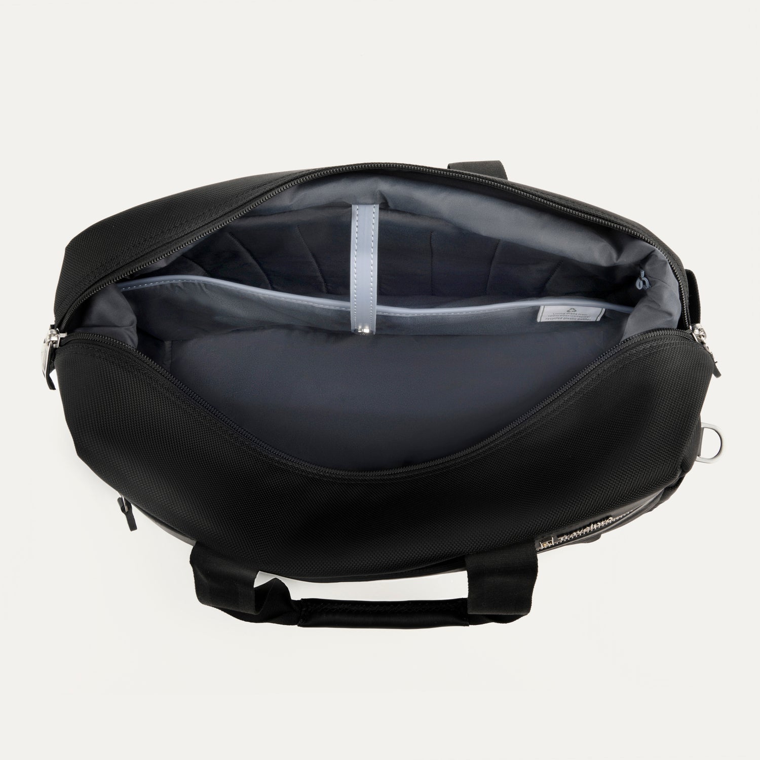 interior view of the open black travelpro platinum elite underseat tote, showing the spacious main compartment with a grey lining and a small leather-trimmed internal pocket.