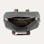 interior view of the open vintage grey travelpro platinum elite underseat tote, showing the spacious main compartment with a tan lining and small internal storage pockets.