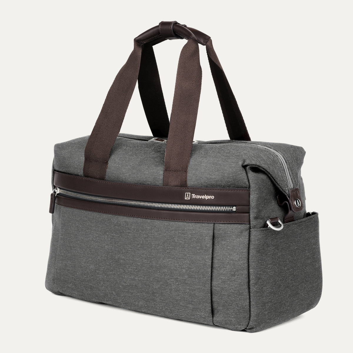 a three-quarter perspective view of the vintage grey travelpro platinum elite underseat tote, highlighting the textured grey fabric, brown leather trim, front zippered pocket, and side accessory pocket.