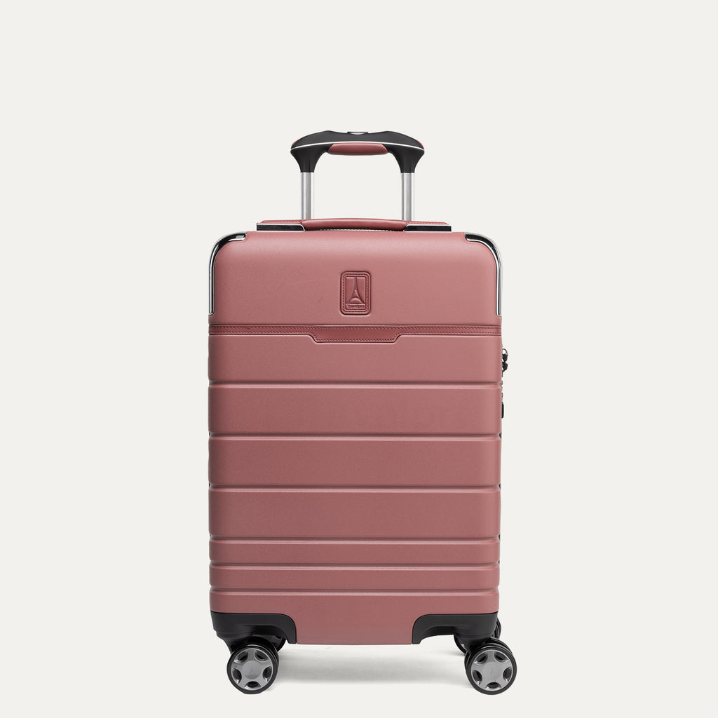 Front view of Travelpro x Travel and Leisure Compact Carry-On Expandable Spinner in Astro Dust Red, featuring 100% polycarbonate hard shell and zinc corner armor