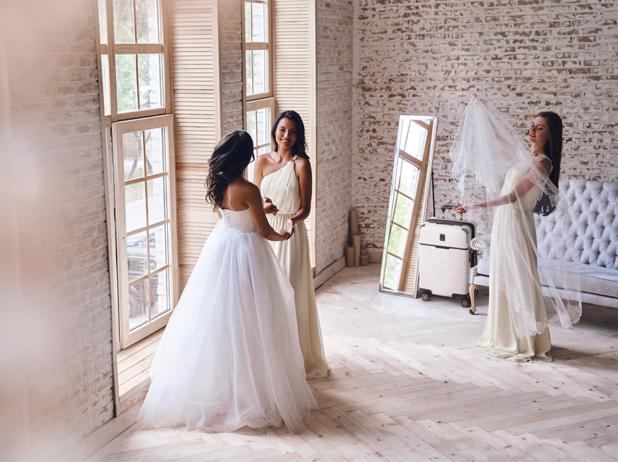 two brides in room with mirror