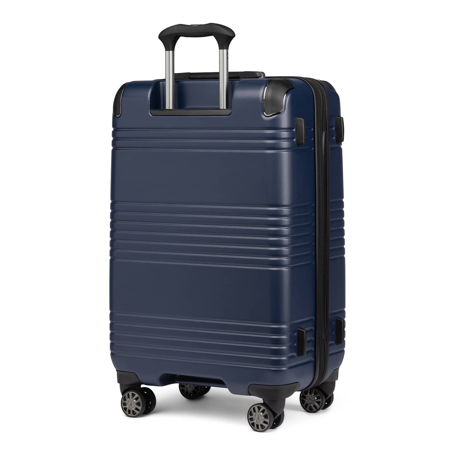 Rear view of Travelpro Roundtrip Medium Check‑In Expandable Spinner in Navy, showing textured hardshell design, black telescoping handle, and four spinner wheels against white background.