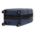 Bottom view of Travelpro Roundtrip Medium Check‑In Expandable Spinner in Navy, showing textured hardshell design, four spinner wheels, and expansion zipper against white background.