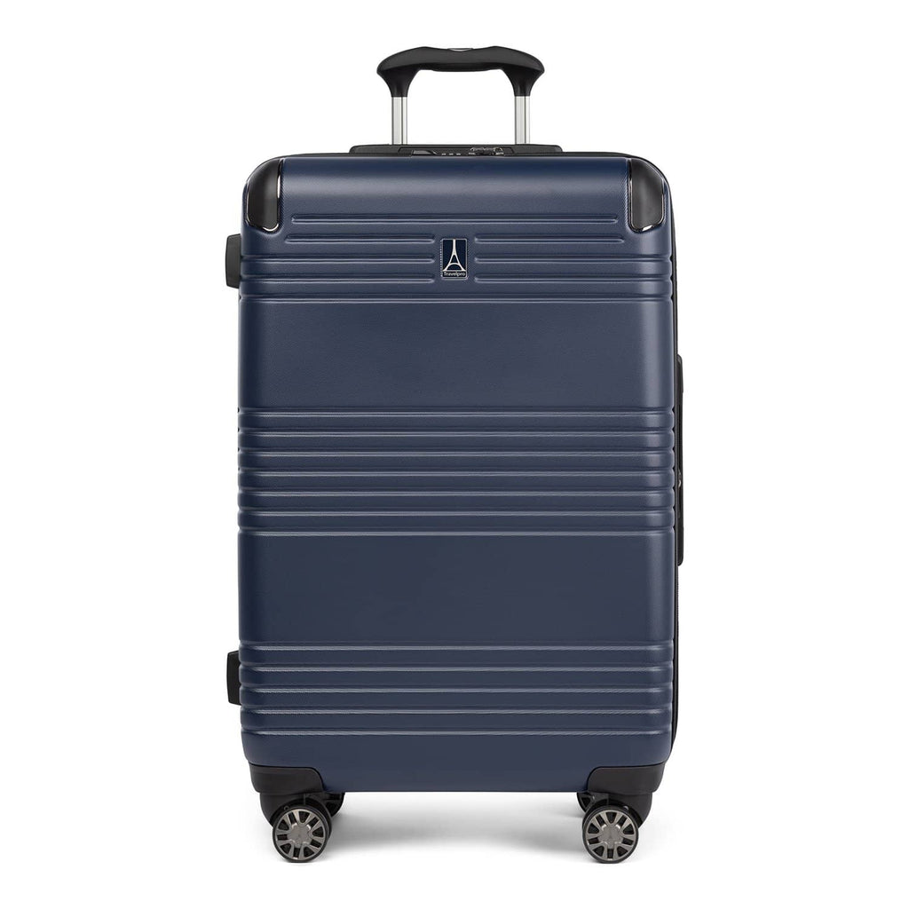 Front view of Travelpro Roundtrip Medium Check‑In Expandable Spinner in Navy, showing textured hardshell design, black trim, four spinner wheels, and telescoping handle against white background.