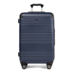 Front view of Travelpro Roundtrip Medium Check‑In Expandable Spinner in Navy, showing textured hardshell design, black trim, four spinner wheels, and telescoping handle against white background.