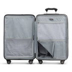 Interior view of Travelpro Roundtrip Medium Check‑In Expandable Spinner in Navy, showing dual‑compartment design with zippered mesh divider and adjustable packing straps against white background.