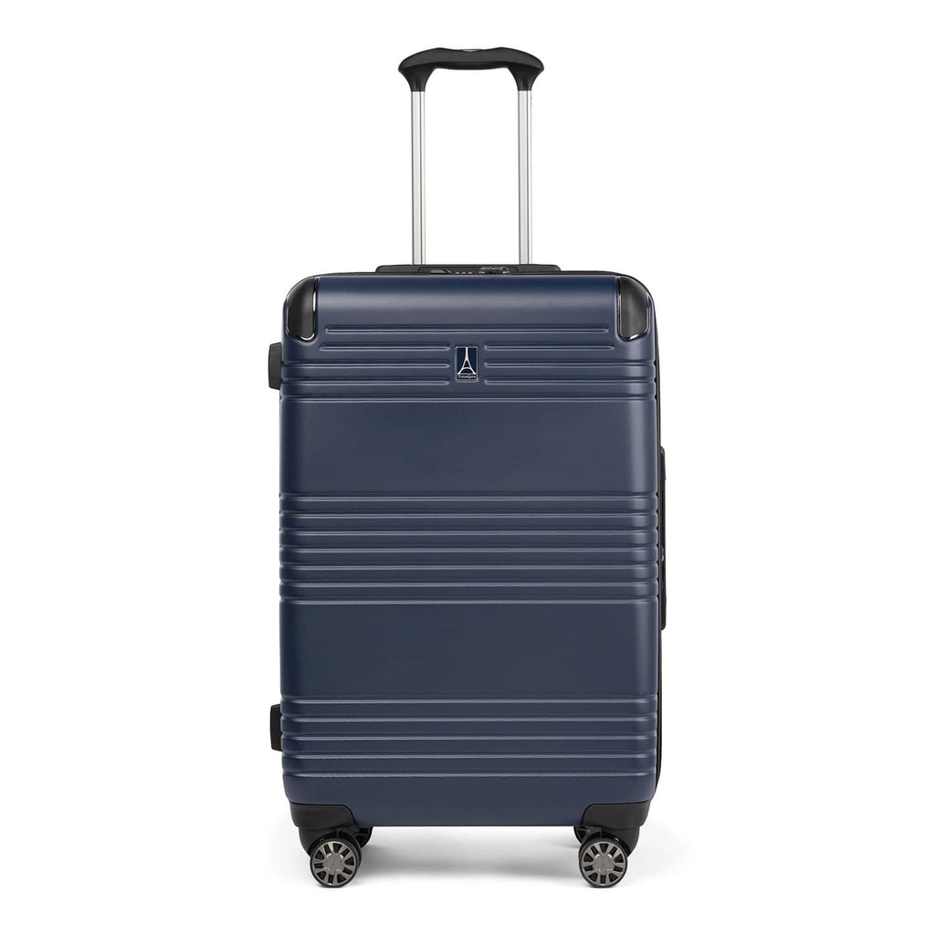 Front view of Travelpro Roundtrip Medium Check‑In Expandable Spinner in Navy, showing textured hardshell design with horizontal grooves, black trim, four spinner wheels, and telescoping handle against white background.